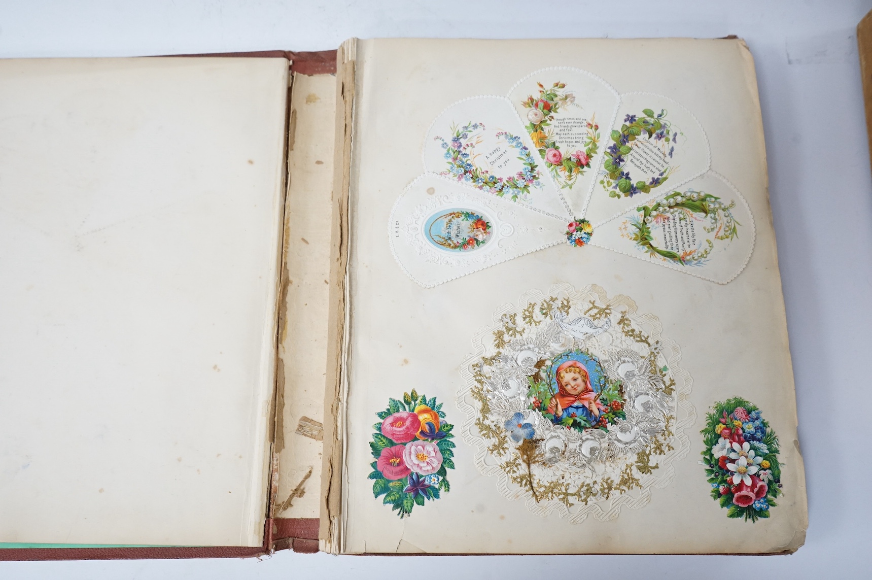 A Victorian album of greetings cards and decoupage. Condition - good